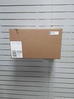 Closed shipping box containing the item