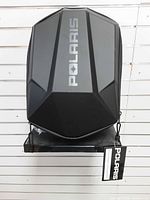 Top view of black Polaris Adventure rack bag showing logo and molded lid