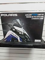 Front of sealed box showing Polaris auxiliary flood light kit