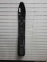 Full view of black Polaris snowmobile ski