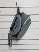 Front view of Polaris underseat bag hanging, showing overall shape and color