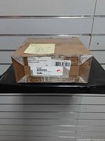 Closed cardboard box showing overall packaging