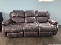 Front view of three-seat leather sofa