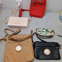 Group shot of all five purses laid out
