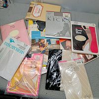 All fifteen packaged pantyhose spread on surface