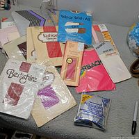 Group shot of all sealed pantyhose packages on table