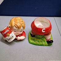 Cookie jar disassembled showing body base and lid depicting boy holding soup can