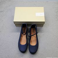 Shoes displayed upright in front of Clarks box showing uppers, straps, size and box