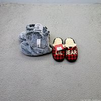 Snow boots and slippers front view with tags visible