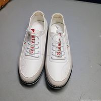 Top view of both KLKYKO shoes showing design, branding, laces, and size