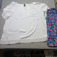 White blouse and floral skirt laid out