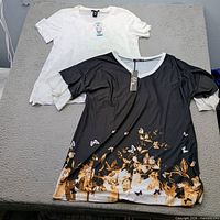 Both tops laid flat showing overall design