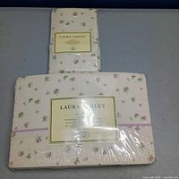 Both sealed Laura Ashley bedding packages front view