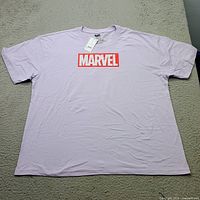 Front view of lilac Marvel T-shirt with tag