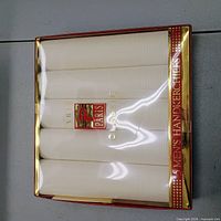 Retail box with five white handkerchiefs, Paris Classics label and "5 Men's Handkerchiefs" text visible