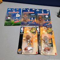 Group shot of all six sealed blister-pack figures