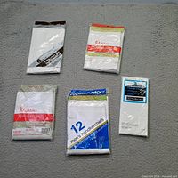Group shot showing five vintage handkerchief packages