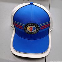 Front view showing embroidered 75th Anniversary patch and visor