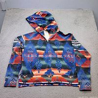 Hoodie laid flat showing full front, pattern, hood and sleeves