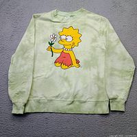 Front view of sweatshirt displaying Lisa Simpson graphic