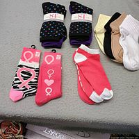 all 16 pairs of women’s socks displayed on surface