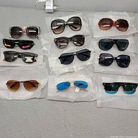 All twelve sunglasses laid out on protective foam