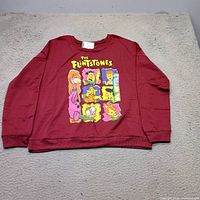 Front of burgundy long-sleeve T-shirt showing graphic and overall condition