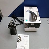 Steamer, cord, manual and box overview