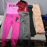 Two jackets and four pants laid out