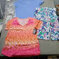 Overview of all three Woman Within garments laid out