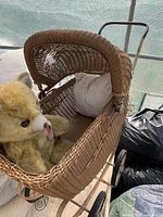 Top angle of carriage interior with stuffed bear and pillow