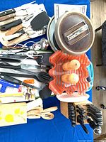 Overview of lot: knife block, Presto PowerPop popper, orange bowl, assorted utensils, knives, salt & pepper mills