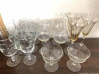 Group of assorted stemware on dark surface