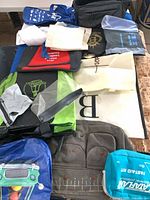 Group shot of nine assorted bags and pouches