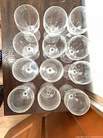 Overhead view of all 12 clear stemmed wine glasses