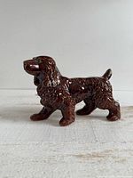 full side view of brown glazed ceramic cocker spaniel figurine