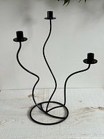 front view showing overall form with three wavy arms