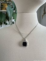 Necklace on bust showing pendant and chain