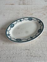 Full view of oval tray showing border pattern