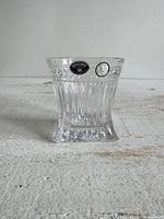 Full view of crystal tumbler showing heavy square base, fluted sides and original stickers