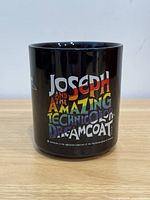 Front view showing multicoloured title graphic