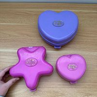 All three compact cases closed showing shapes and colours