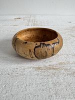 Top angled view of maple burl bowl showing overall shape and wood grain