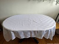 Tablecloth spread on table showing full size and pattern