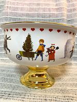 Side view showing illustration with tree cart and gold base