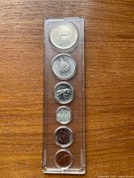 Front view of six-coin set in Whitman holder