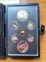 Full view of proof set inside case showing all seven coins