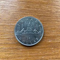 Reverse side of 1981 Canadian one-dollar coin showing canoe design and date