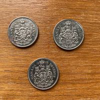 Three Canadian 50 cent coins dated 1968, 1972, 1978 reverse side