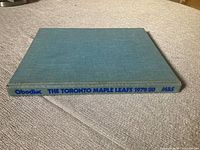 Blue cloth hardcover book spine showing title and author